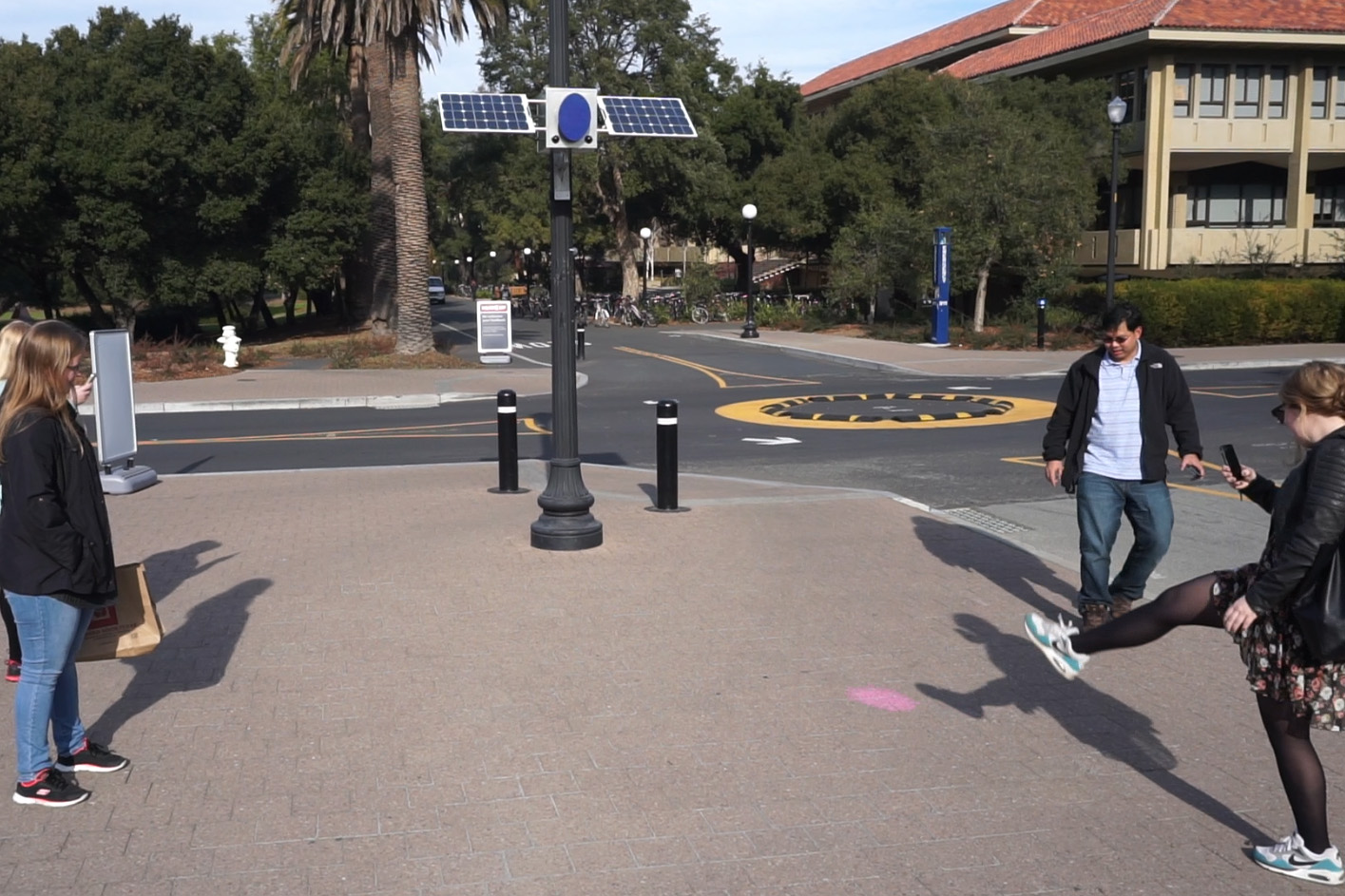 Three people playing on the street